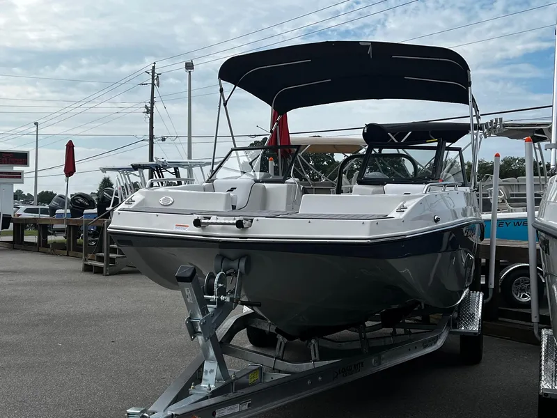 Slide: The Image of 2024 Starcraft SVX 190 boat on a trailer with a black canopy. - 3