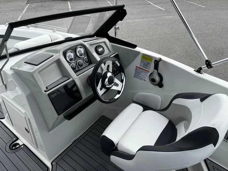 Slide: The Image of 2024 Starcraft SVX 190 boat cockpit with steering wheel and dashboard. - 9