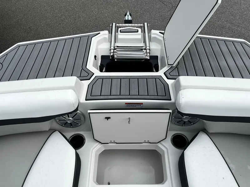Slide: The Image of 2024 Starcraft SVX 190 boat interior with storage compartments and seating. - 17