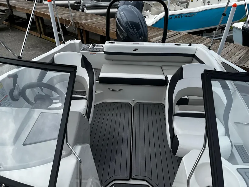 Slide: The Image of 2024 Starcraft SVX 190 boat interior with seating and steering wheel. - 18