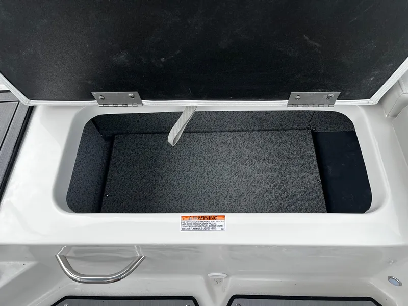Slide: The Image of Open storage compartment on a 2024 Starcraft SVX 190 boat. - 6