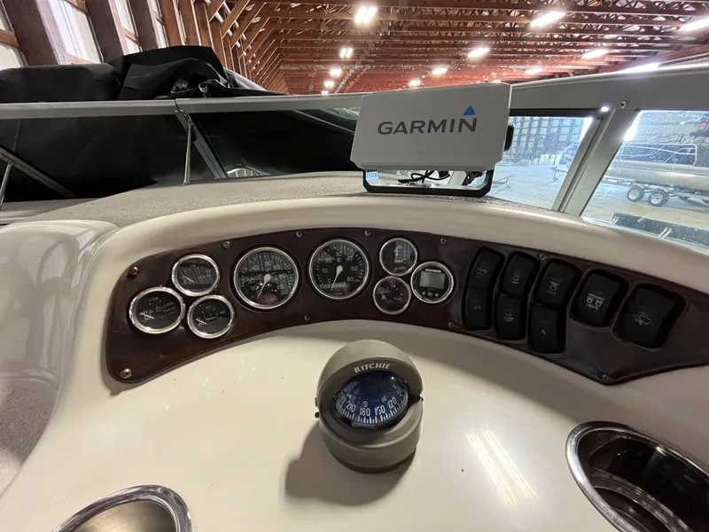 Slide: The Image of Dashboard of 2000 Crownline 242 CR boat with Garmin navigation system. - 11
