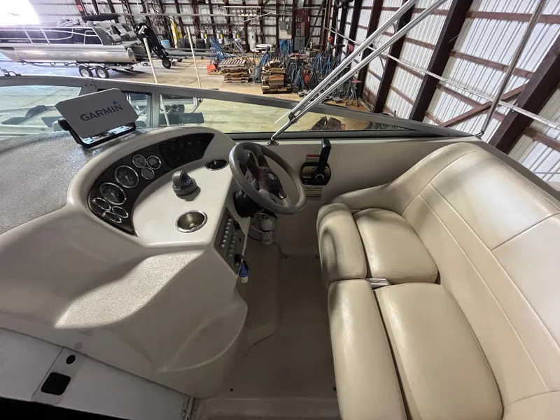Slide: The Image of Interior of a 2000 Crownline 242 CR boat with Garmin navigation system. - 13
