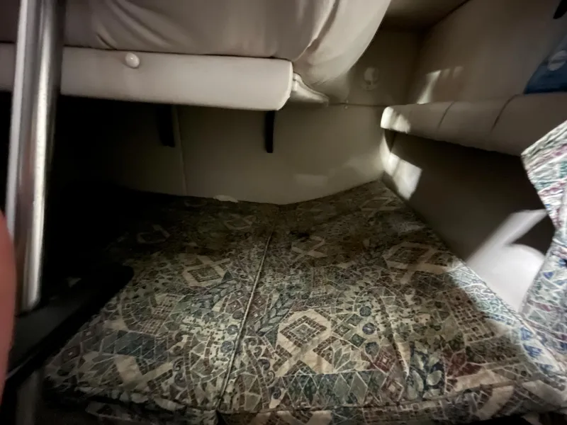Slide: The Image of Interior cabin of 2000 Crownline 242 CR boat with patterned cushions. - 20