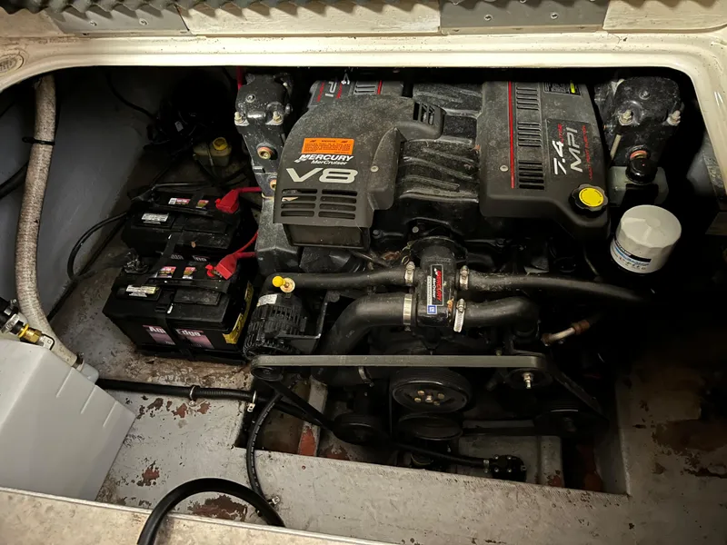 Slide: The Image of Engine compartment of a 2000 Crownline 242 CR boat with a Mercury V8 engine. - 5