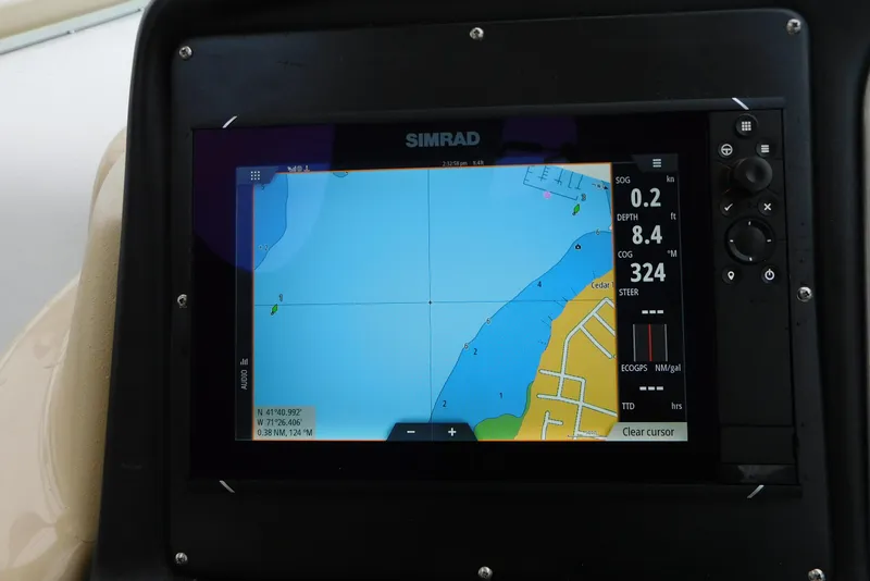 Slide: The Image of Simrad navigation display on 2005 Cruisers Yachts 520 Express, showing coastal map and data. - 14