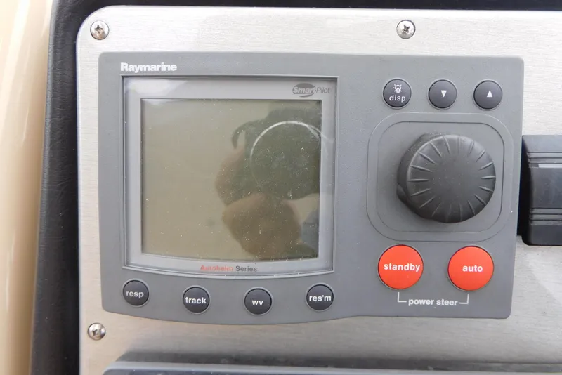 Slide: The Image of Raymarine navigation system on 2005 Cruisers Yachts 520 Express dashboard. - 15