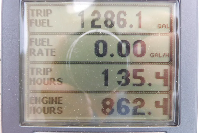 Slide: The Image of Display screen showing trip fuel, fuel rate, trip hours, and engine hours for 2005 Cruisers Yachts 520 Express. - 19