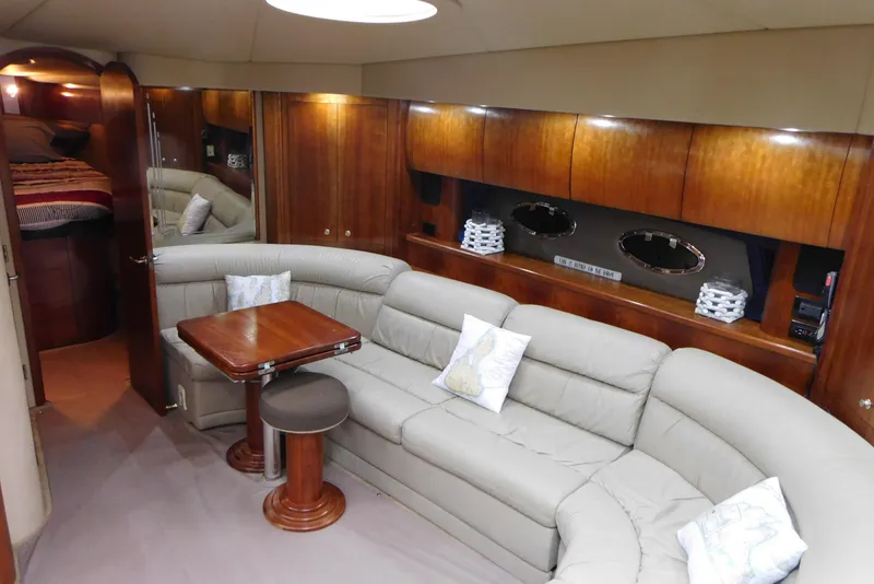 Slide: The Image of Luxurious interior of 2005 Cruisers Yachts 520 Express with plush seating and elegant wood finishes. - 23