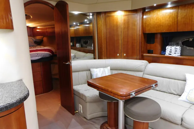 Slide: The Image of Luxurious interior of 2005 Cruisers Yachts 520 Express with elegant wood finishes and cozy seating. - 26