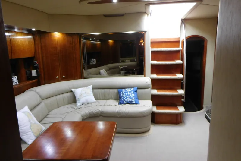 Slide: The Image of Luxurious interior of 2005 Cruisers Yachts 520 Express with plush seating and wooden accents. - 33