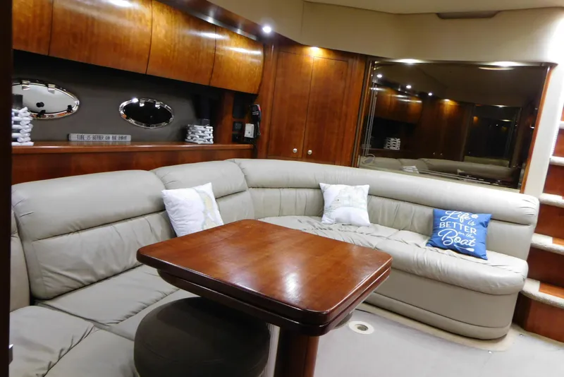 Slide: The Image of Luxurious 2005 Cruisers Yachts 520 Express interior with plush seating and elegant wood finishes. - 34