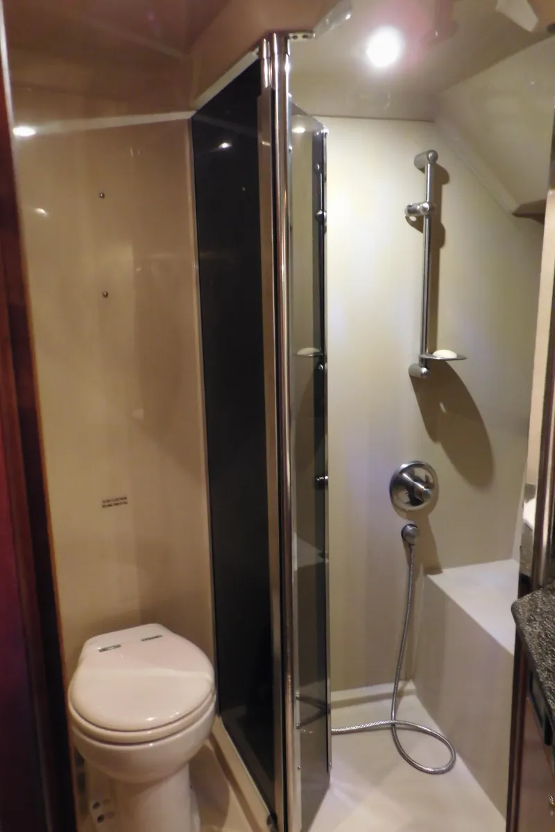 Slide: The Image of 2005 Cruisers Yachts 520 Express bathroom with shower and toilet. - 45