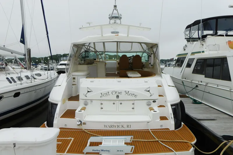 Slide: The Image of 2005 Cruisers Yachts 520 Express docked at marina, rear view. - 5