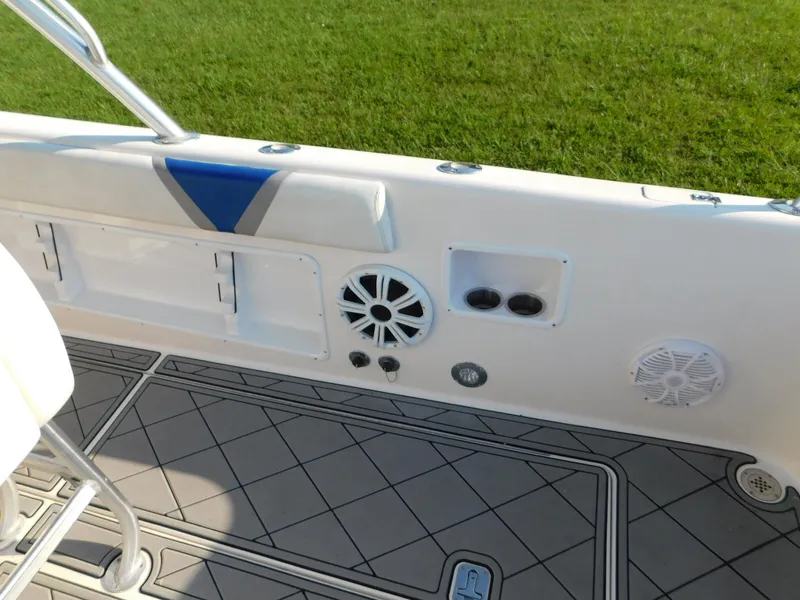 Slide: The Image of Interior view of a 2005 Solid Craft LIMITED 40 boat, featuring speakers and storage compartments. - 10