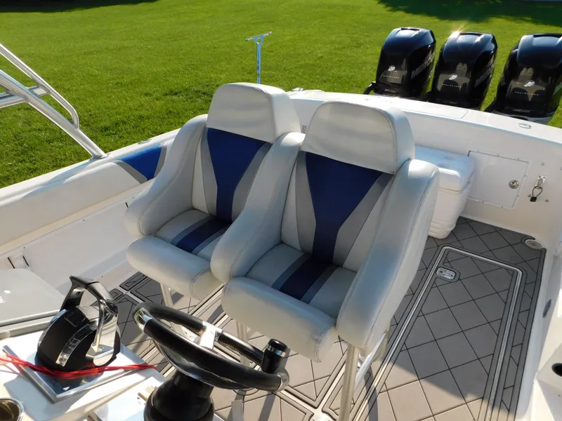 Slide: The Image of Interior of 2005 Solid Craft LIMITED 40 boat with dual seats and steering wheel. - 12