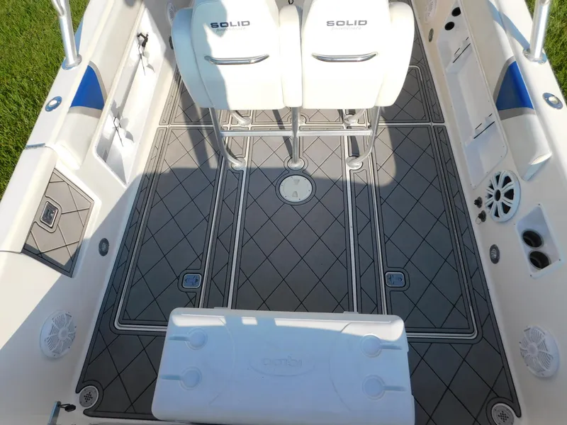 Slide: The Image of Interior of 2005 Solid Craft LIMITED 40 boat with patterned flooring and white seating. - 16