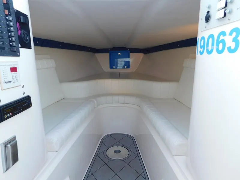 Slide: The Image of Interior of 2005 Solid Craft LIMITED 40 boat, featuring white seating and control panels. - 18