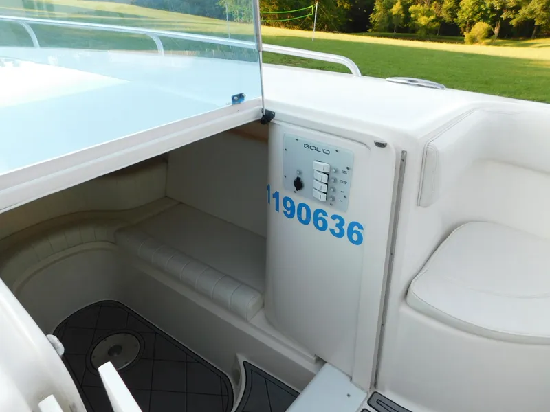 Slide: The Image of Interior view of a 2005 Solid Craft LIMITED 40 boat, featuring seating and control panel. - 20