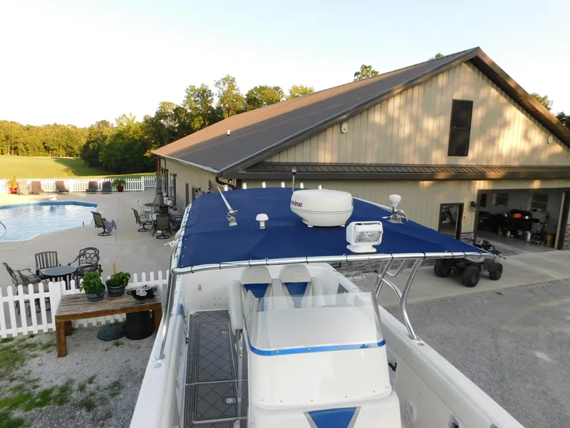Slide: The Image of Solid Craft LIMITED 40 boat, 2005 model, docked near a house with a pool and patio. - 22