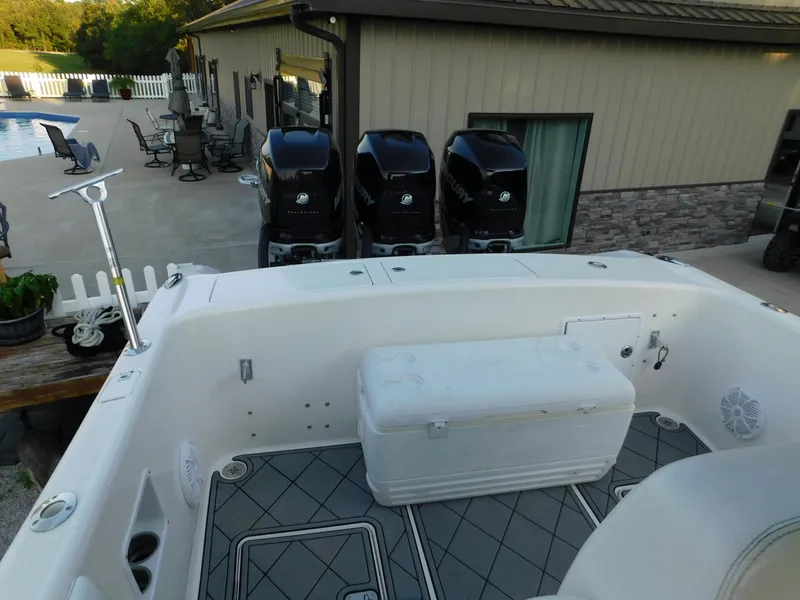 Slide: The Image of Solid Craft LIMITED 40 boat, 2005 model, with triple outboard motors and spacious deck area. - 24