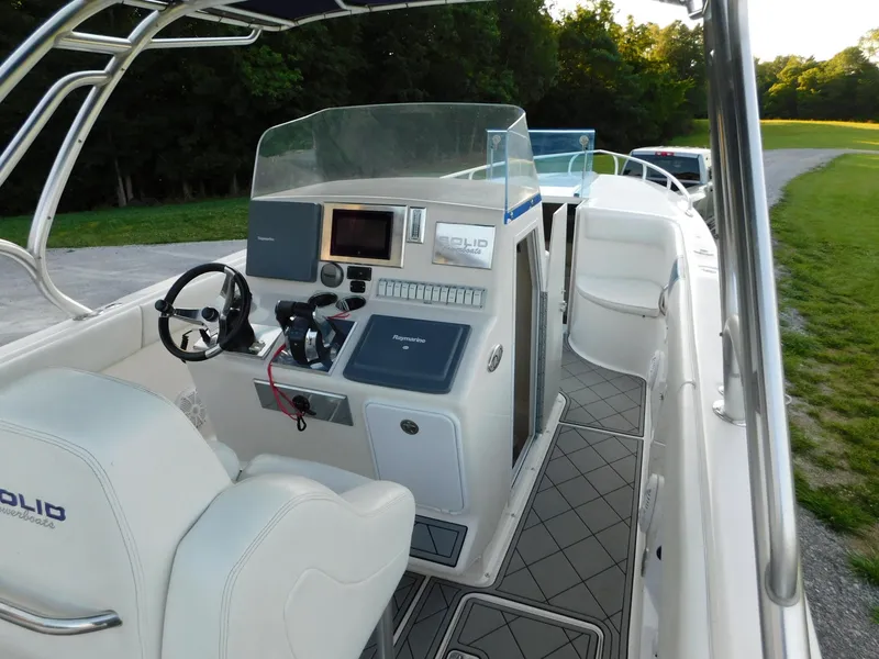 Slide: The Image of Solid Craft LIMITED 40 boat interior, 2005 model, featuring steering console and seating. - 25