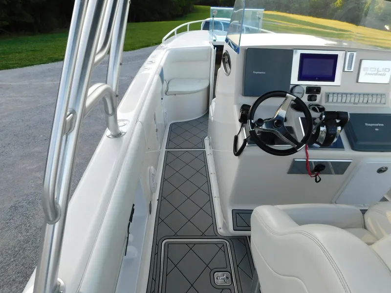Slide: The Image of Interior view of 2005 Solid Craft LIMITED 40 boat, featuring steering console and seating. - 26