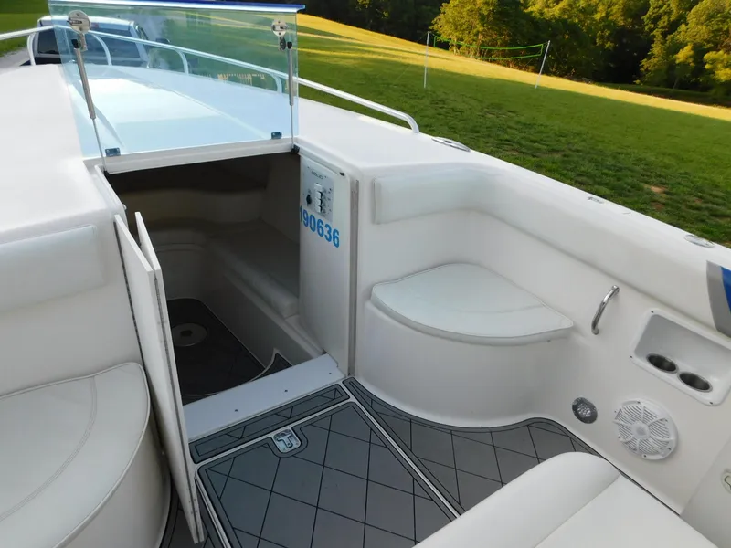 Slide: The Image of Interior of 2005 Solid Craft LIMITED 40 boat with white seating and open cabin door. - 30