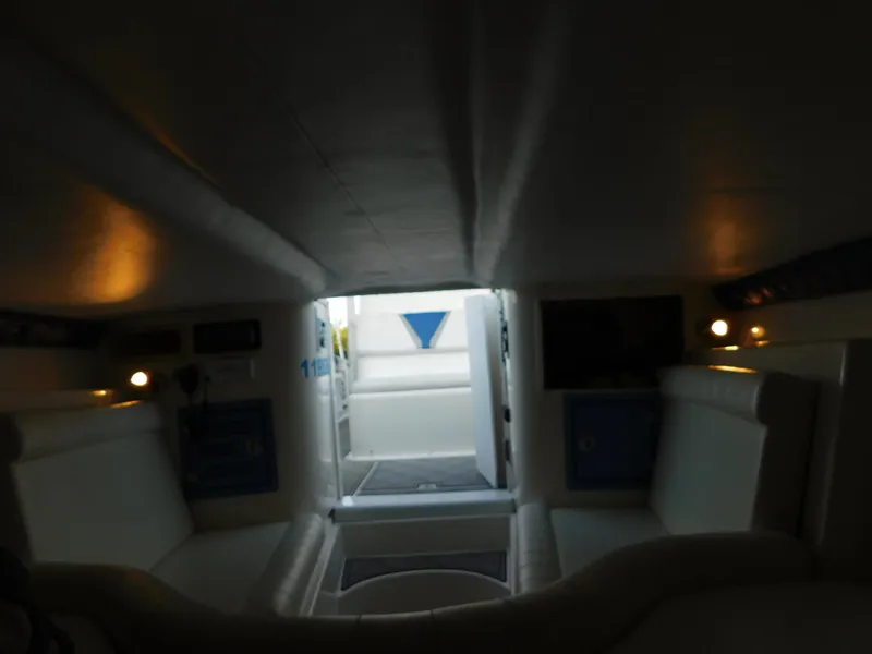 Slide: The Image of Interior of 2005 Solid Craft LIMITED 40 boat, featuring seating and ambient lighting. - 33