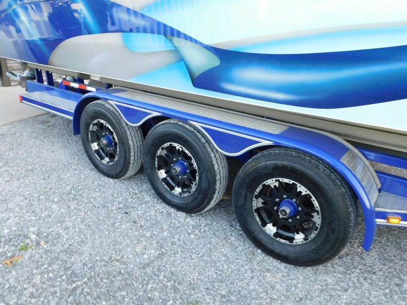 Slide: The Image of Triple-axle trailer with blue accents, Solid Craft LIMITED 40, 2005 model. - 38