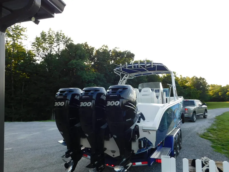 Slide: The Image of Four-engine Solid Craft LIMITED 40 boat on trailer, parked outdoors, 2005 model. - 39