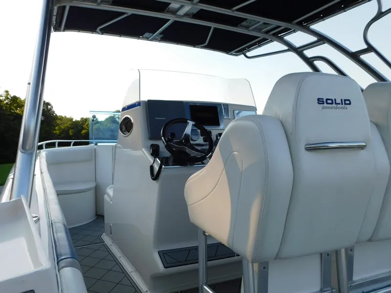 Slide: The Image of Interior of a 2005 Solid Craft LIMITED 40 boat with steering console and seating. - 42
