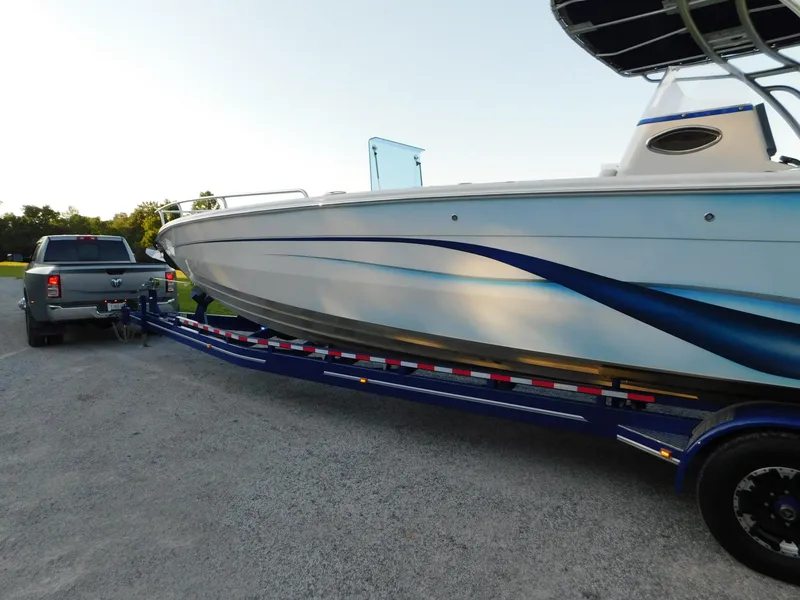 Slide: The Image of Solid Craft LIMITED 40 boat on trailer, hitched to a truck, outdoors, 2005 model. - 45