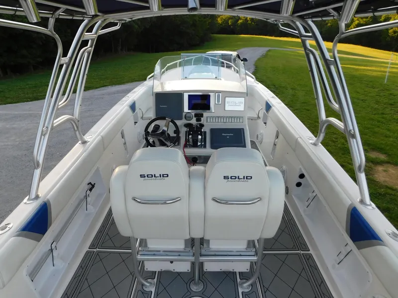 Slide: The Image of 2005 Solid Craft LIMITED 40 boat interior with dual seats and control panel. - 46