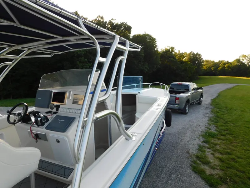 Slide: The Image of Boat Solid Craft LIMITED 40, 2005 model, on trailer with truck in scenic outdoor setting. - 48