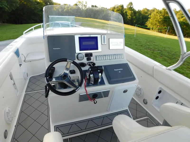 Slide: The Image of Steering console of 2005 Solid Craft LIMITED 40 boat with modern navigation equipment. - 49
