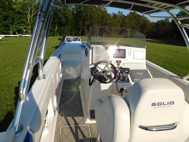 Slide: The Image of Solid Craft LIMITED 40 boat interior, 2005 model, featuring steering wheel and control panel. - 5
