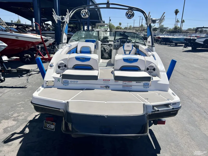 Slide: The Image of 2019 Chaparral Vortex 223 VRX boat in a marina, rear view. - 1