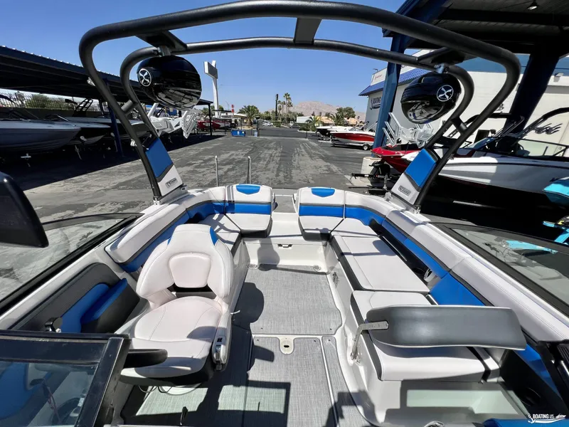 Slide: The Image of 2019 Chaparral Vortex 223 VRX boat interior with blue and white seating. - 3