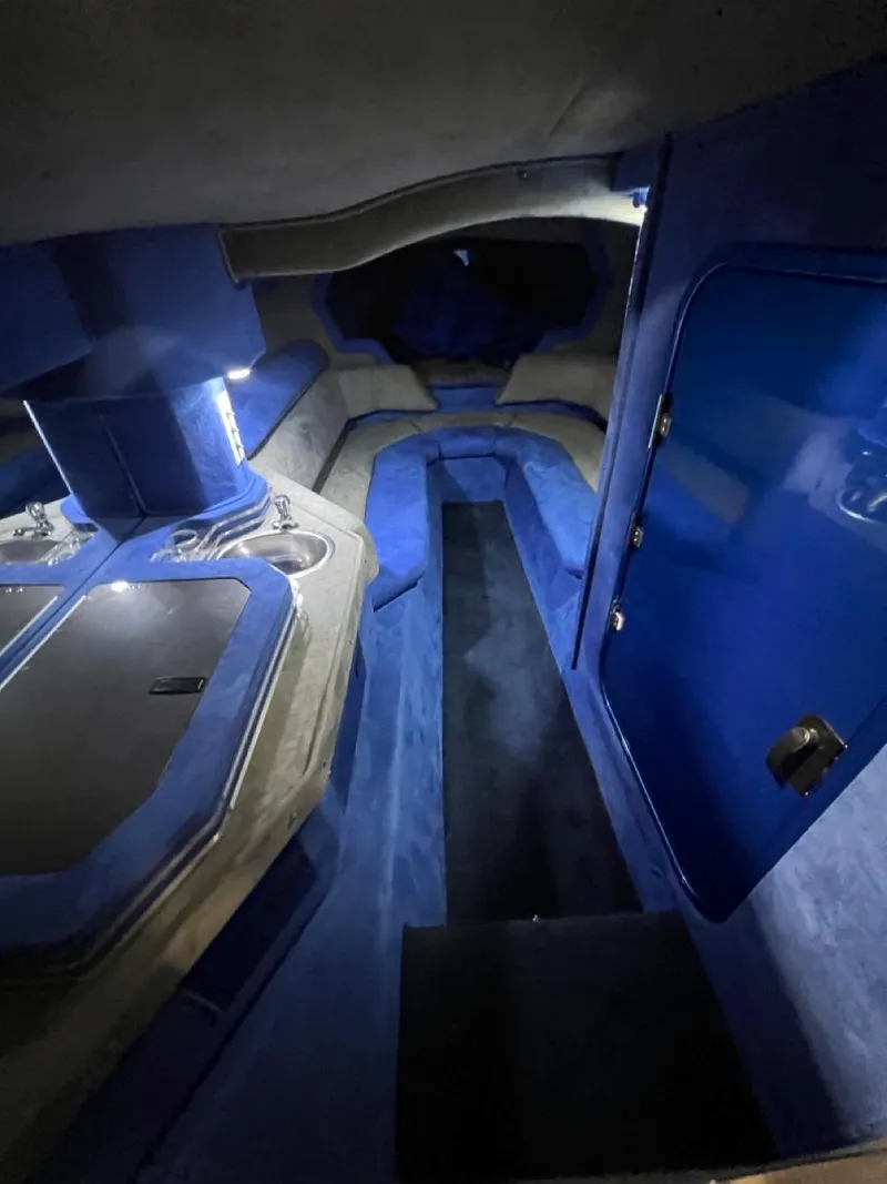 Slide: The Image of Interior of a 2007 Fountain 42 Lightning boat with blue and gray upholstery. - 22