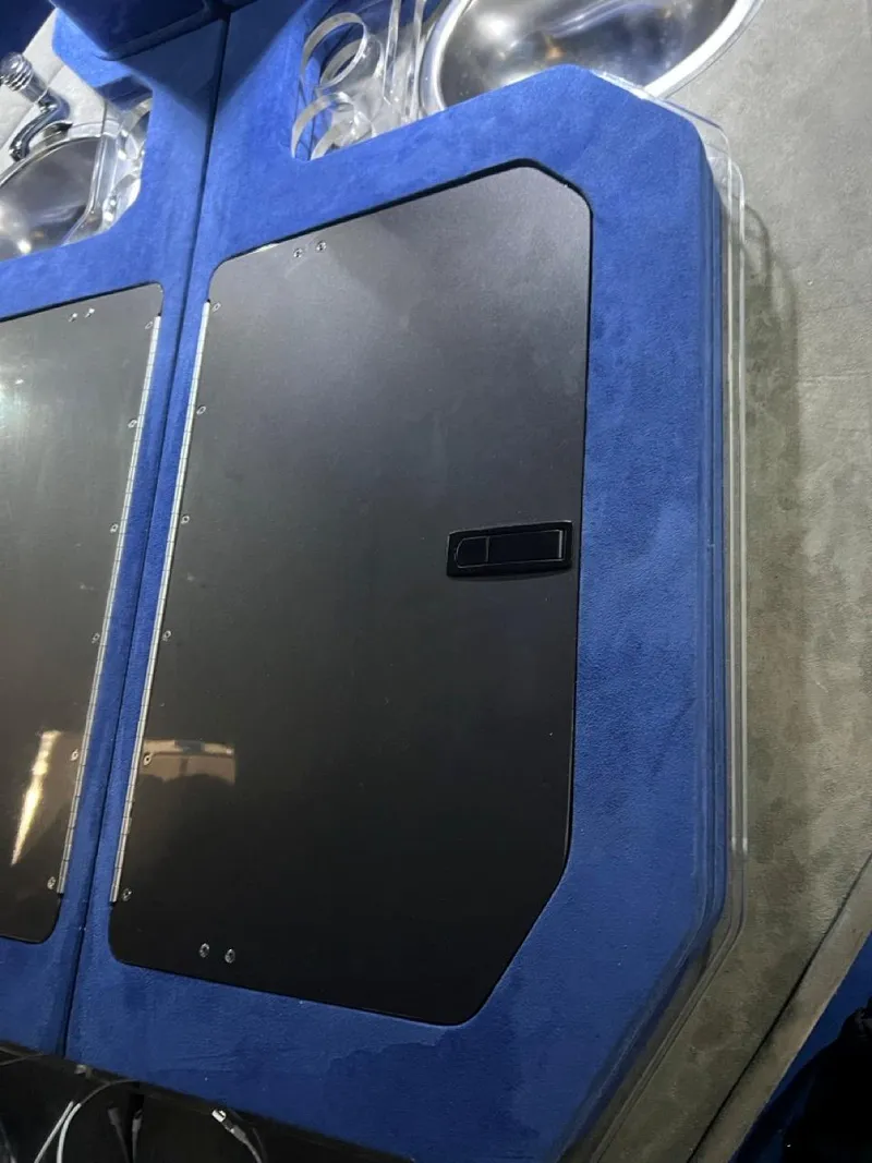 Slide: The Image of 2007 Fountain 42 Lightning boat interior with blue and black accents. - 23