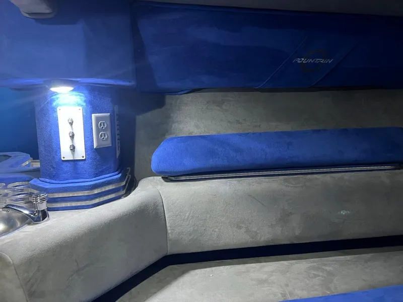 Slide: The Image of Interior of a 2007 Fountain 42 Lightning boat with blue and gray upholstery. - 25