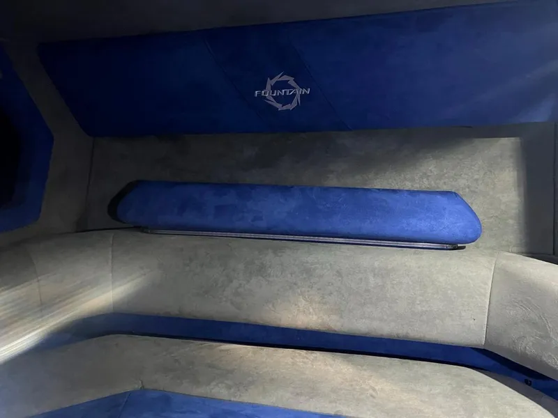 Slide: The Image of Interior of a 2007 Fountain 42 Lightning boat with blue and gray upholstery. - 29