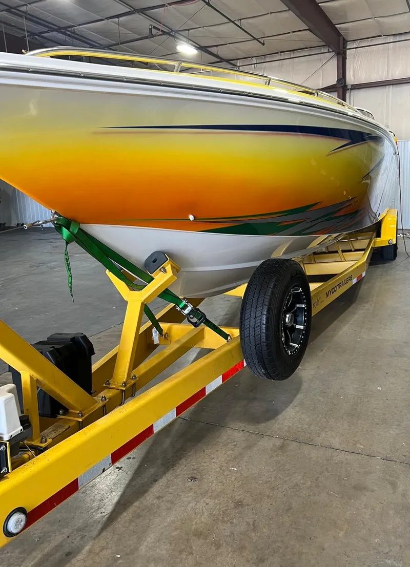 Slide: The Image of 2007 Fountain 42 Lightning speedboat on a yellow trailer in a warehouse. - 3