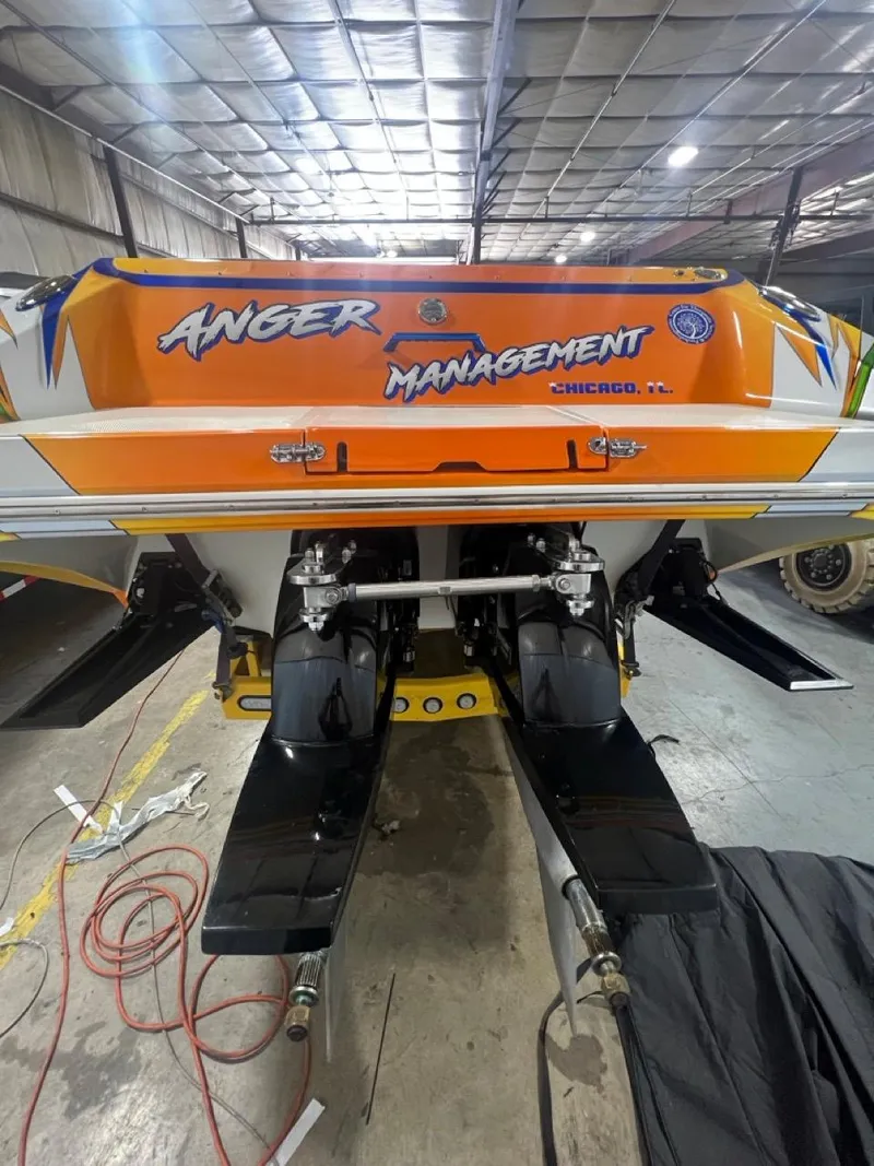 Slide: The Image of 2007 Fountain 42 Lightning speedboat in a garage, rear view. - 6