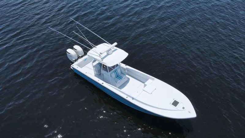 Slide: The Image of Aerial view of a 1990 Intrepid 321 Cuddy boat on the water. - 3