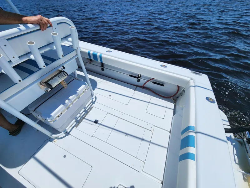 Slide: The Image of 1990 Intrepid 321 Cuddy boat deck on the water. - 7