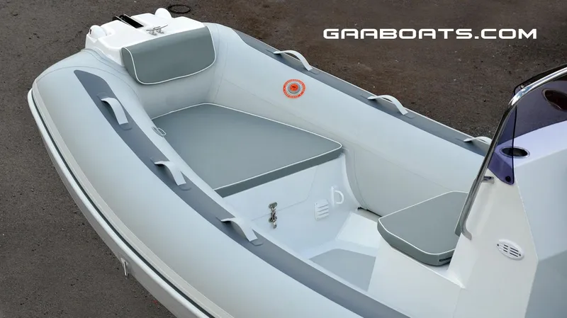 Slide: The Image of 2025 Gala A450 inflatable boat interior with cushioned seating and storage compartments. - 4