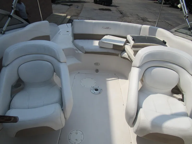 Slide: The Image of 2005 Four Winns Fun Ship 214 boat interior with white seating and spacious layout. - 14
