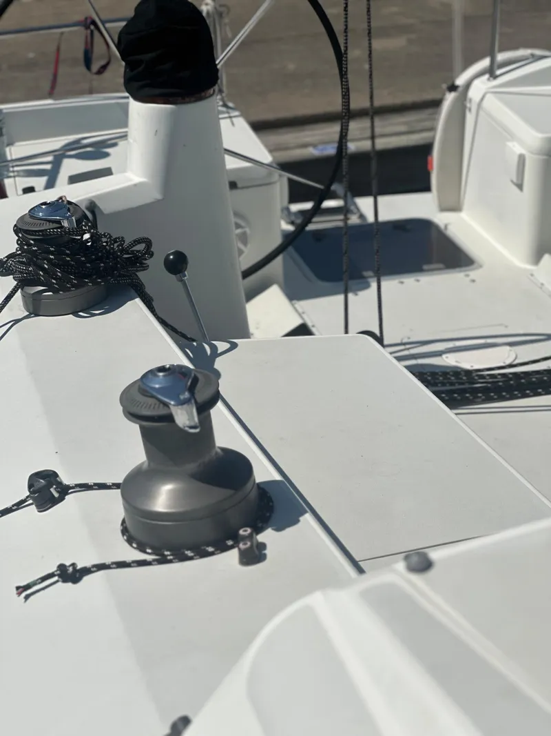 Slide: The Image of Close-up of a white sailboat with winches and ropes on the deck. - 22